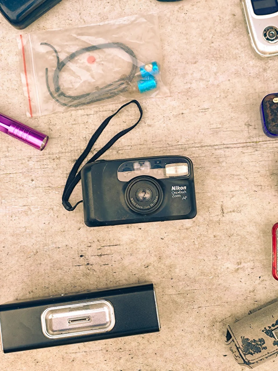 Compact camera and accessories arranged on a tabletop