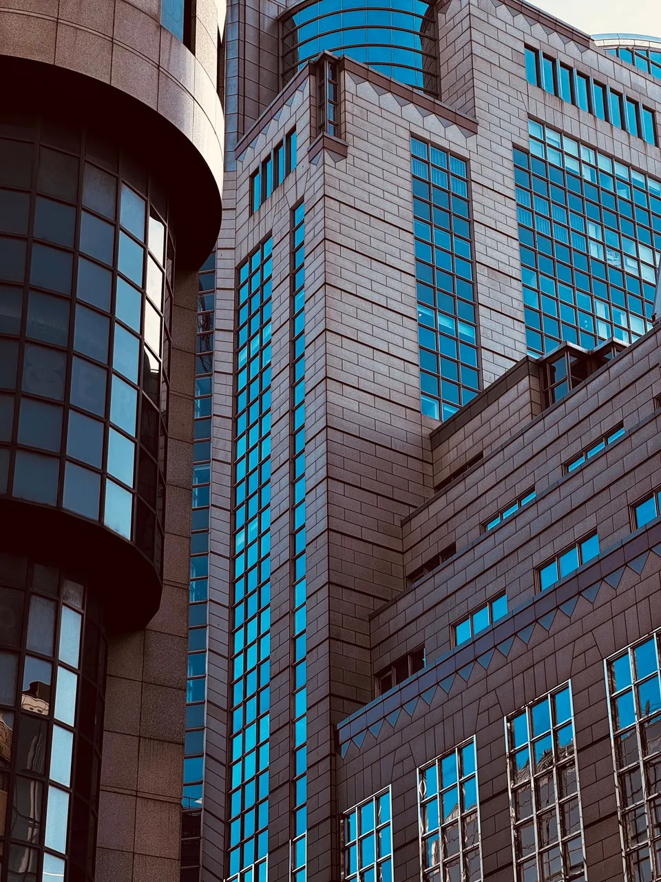 Reflective glass buildings viewed from below