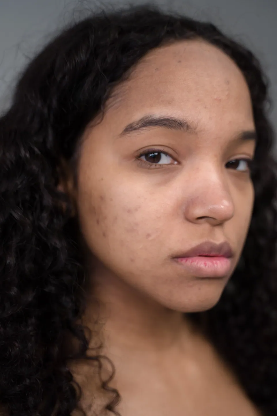 Close-up portrait showing a woman's natural skin texture